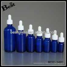 синий эфирное масло бутылка с белым пластиковым колпачком, белая резина, стекло капельницы; капельницы бутылка с белым пластиковым колпачком